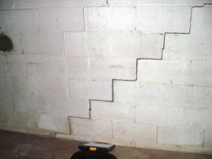 step crack in cinderblock foundation wall